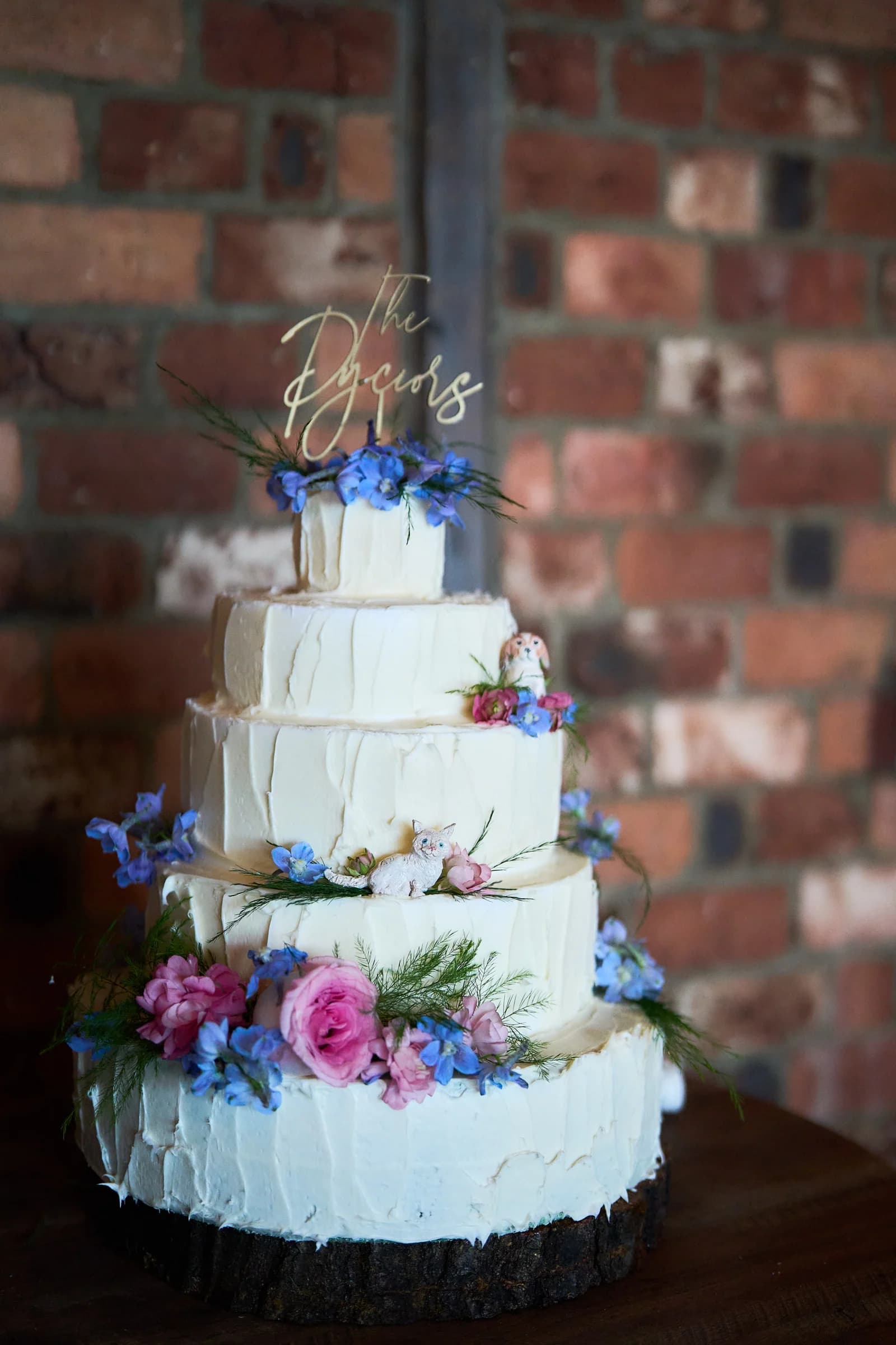 Lombardi's on the Bay, Patchogue, Gabriela and Jakub's four tier wedding cake, The Pyciors, with blue and pink flowers and their cat and dog figurines