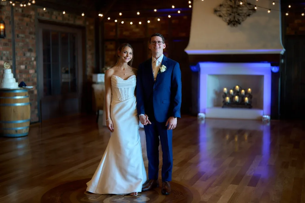 Gurney's Montauk Resort, Montauk, Bride and groom on the floral decorated indoor balcony at the Riviera Waterfront Mansion