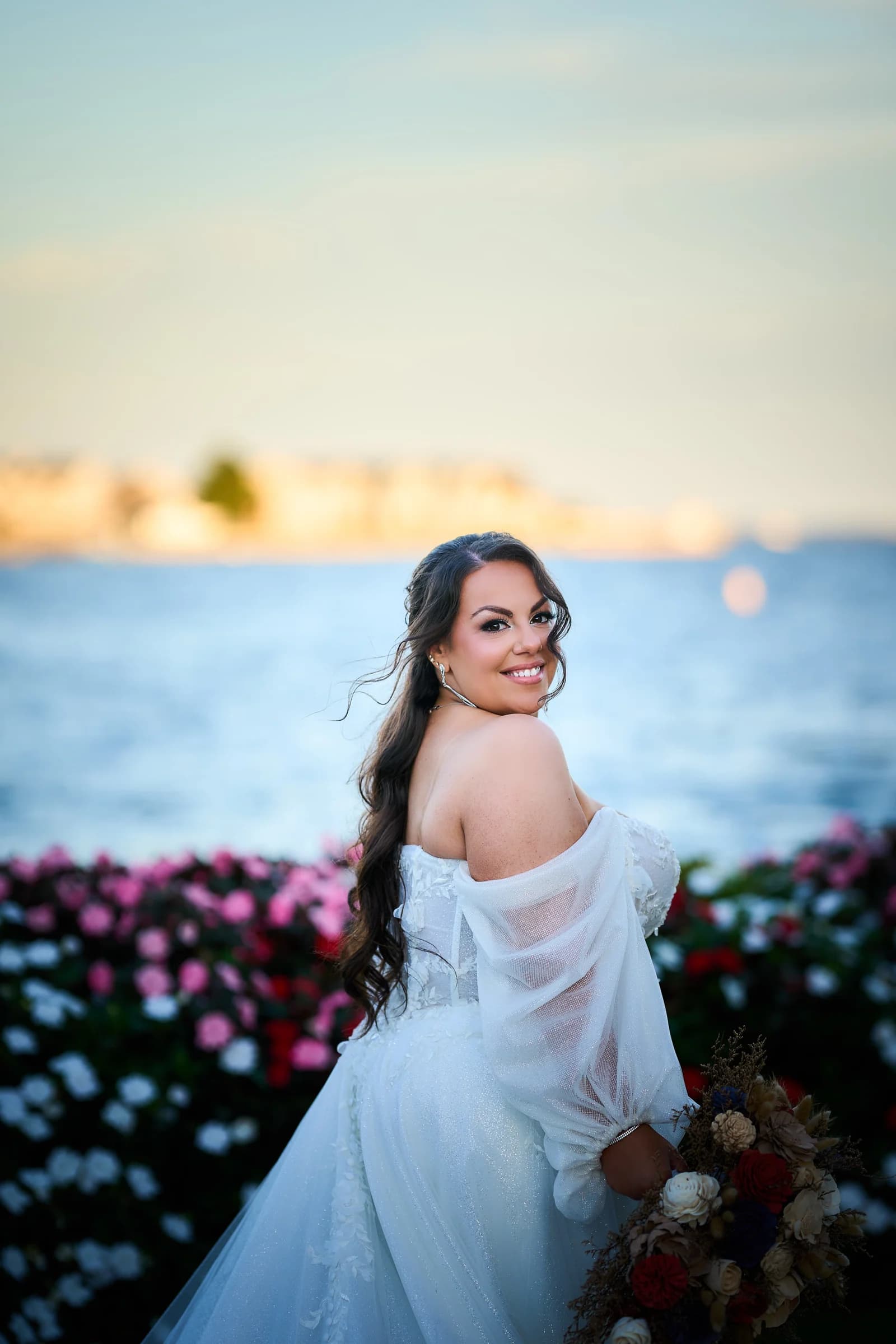 The Swan Club on the Harbor, Roslyn Harbor, Stephanie looking back over her shoulder in the flower beds at the Riviera, bouquet in hand