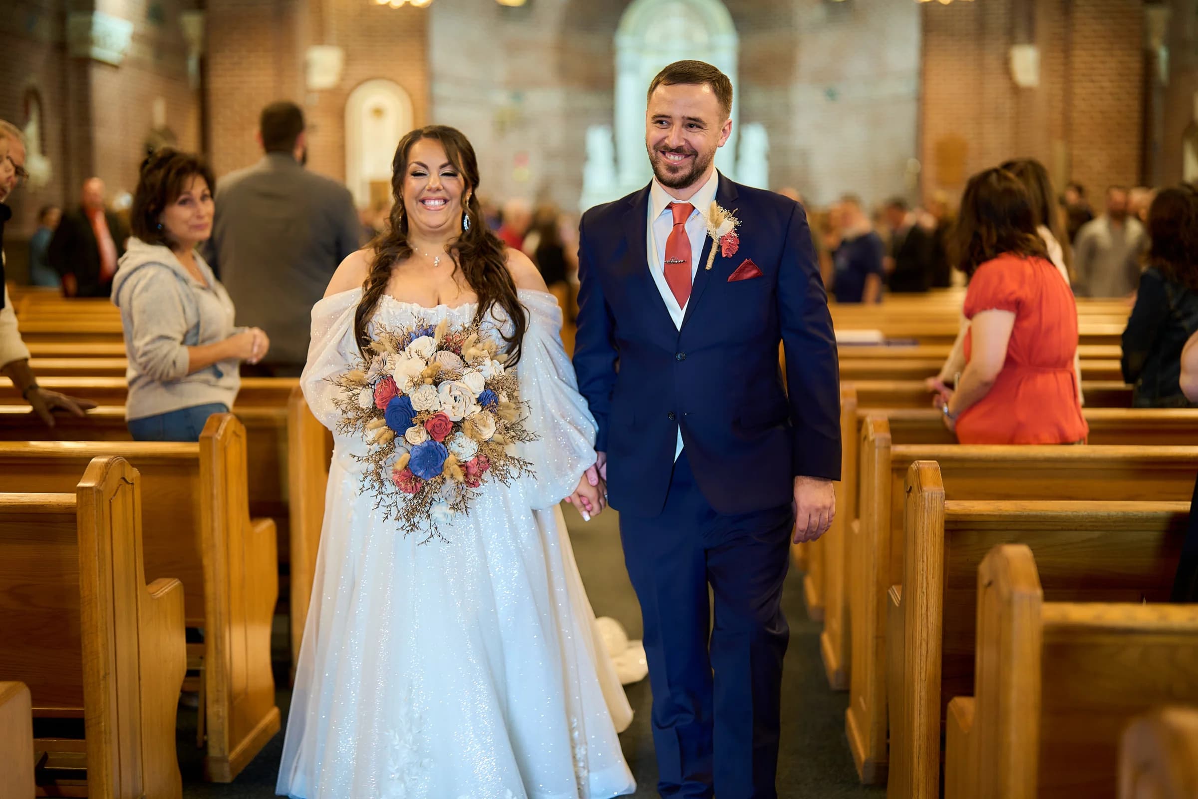 Port Washington Yacht Club, Port Washington, Stephanie and Peter walking the church aisle hand in hand after the ceremony