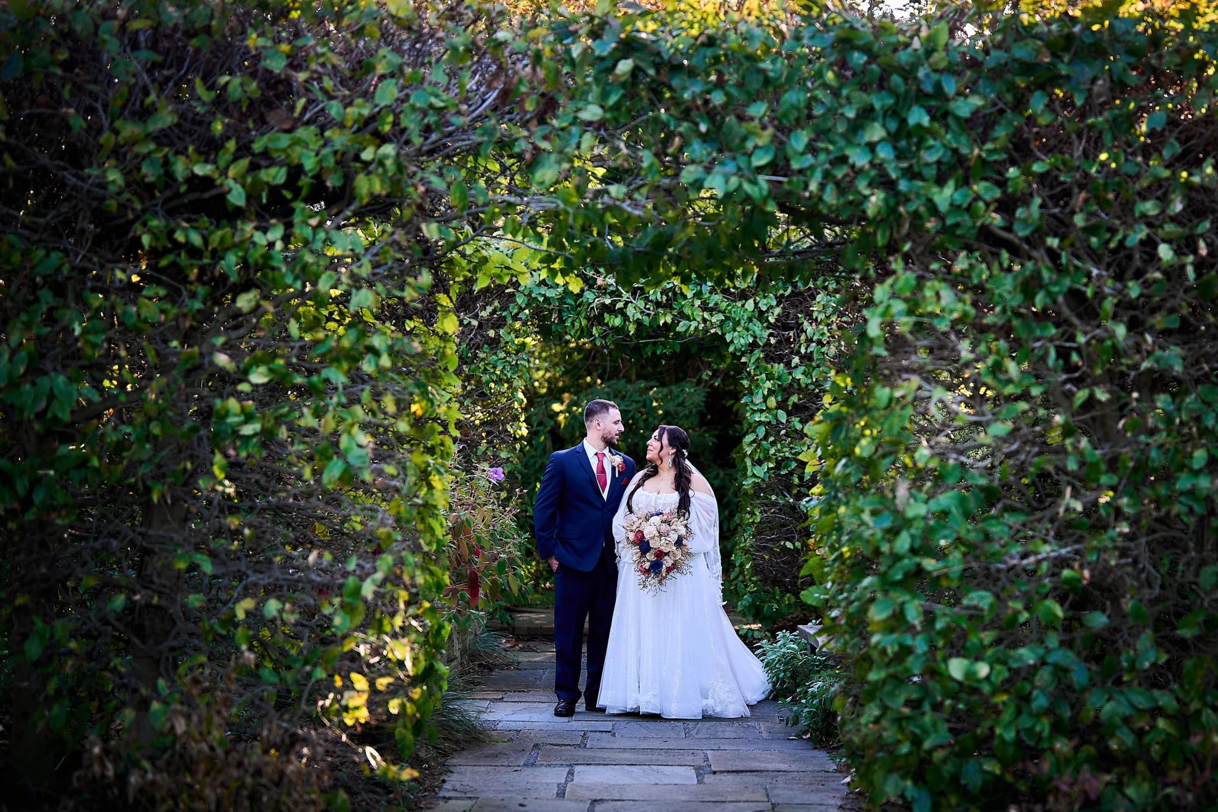 Giorgio's, Baiting Hollow, Stephanie and Peter on the stone path beneath the garden trees at the Riviera